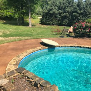 stained concrete pool deck with diamond etching accent