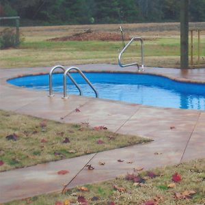 stained concrete pool deck with diamond etching accent